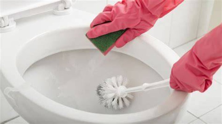 What is the best way to clean under the rim of a toilet?